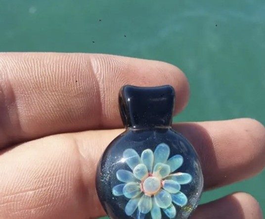 Blue borosilicate glass flower pendant by Jose Valdes