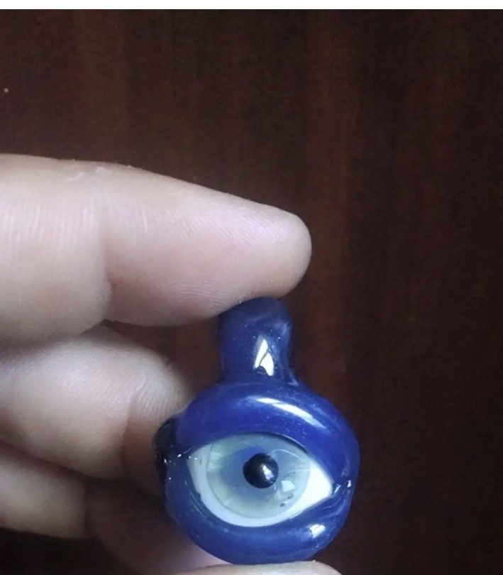 Blue borosilicate glass goblin eye pendant by Jose Valdes